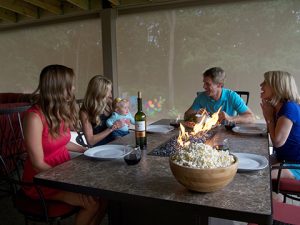 Friends and family in the Midwest enjoying their patio with a Sunesta screen