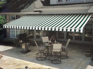 An open Sunesta awning over a patio set in the Midwest
