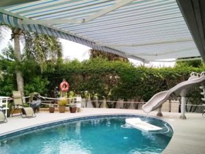 <i> An awning provides poolside shade in the Southeast </i>