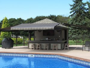 An extended Sunesta awning next to a Southeastern pool