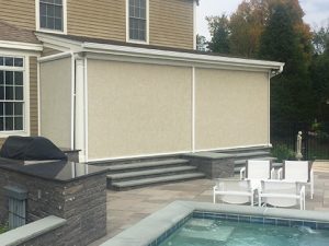 A home in the Northeast featuring an enclosed patio screen