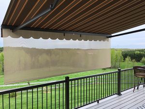 An extended Sunesta awning provides Labor Day shade for a home patio in the Northeast