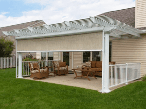 A retractable Sunesta screen is lowering over a home patio in the Northeast